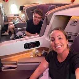 Zach and his wife on a long-haul flight